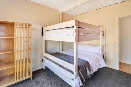 a bedroom with two bunk beds and a closet at Containers on Kidston in Mansfield