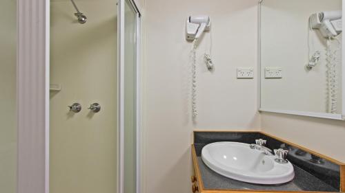 a bathroom with a sink and a shower at Alpine Heights 28 in Mount Hotham