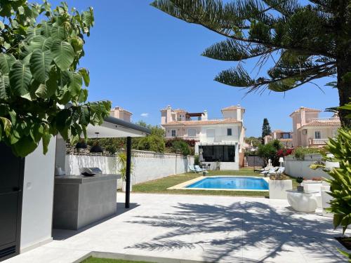 a view of a villa with a swimming pool at Villa Cuqui in Chilches