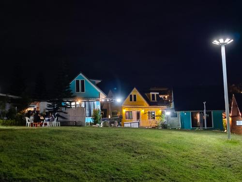 a group of houses at night with a street light at โซพราว เขาค้อ So Proud Khaokho in Khao Kho