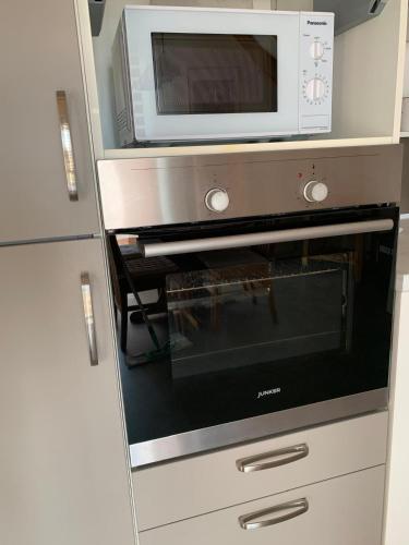 Kuchyň nebo kuchyňský kout v ubytování Ferienwohnung Leonardo
