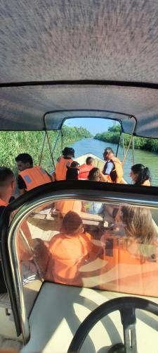 a group of people on a boat in the water at Casa orizont in Sulina