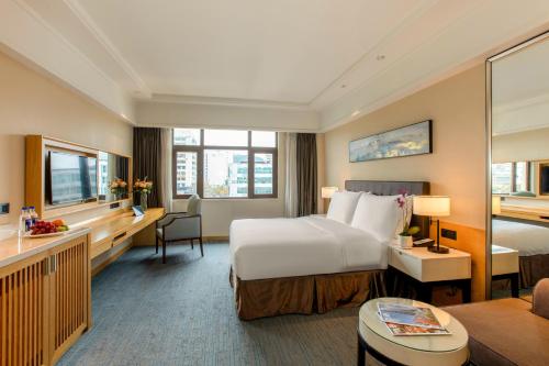 Postel nebo postele na pokoji v ubytování Yiho Hotel Xiamen Huli