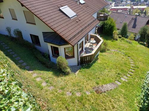 an aerial view of a house with a yard at Ferienwohnung Panoramablick in Bad Wildbad