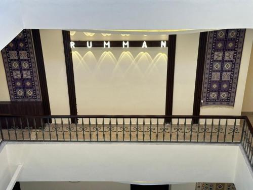 a stairway with a railing and a window at Rumman Hotel in Madaba
