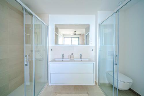 a bathroom with a sink and a toilet and a shower at Sea Views Apartment Lucy in Fuengirola