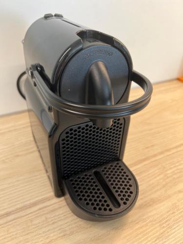 a toaster sitting on top of a wooden table at Die "Boho Suite" im Herzen von Hartberg I Parking in Hartberg