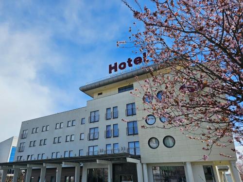 a hotel building with a sign on top of it at Hotel Swing in Kraków