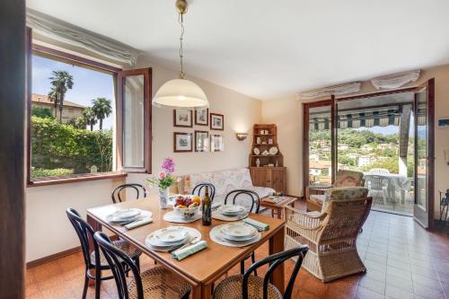 a dining room with a table and chairs at Casa Virginia Apartments in Laveno-Mombello