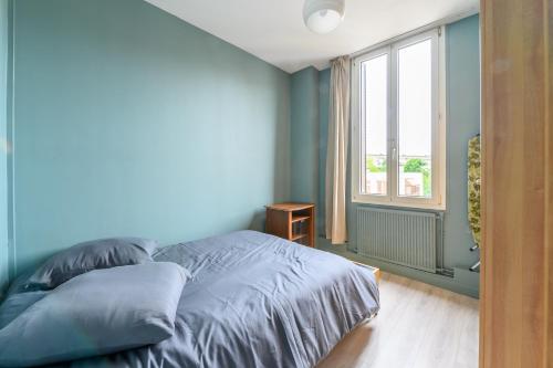 Ένα ή περισσότερα κρεβάτια σε δωμάτιο στο Azurine - Appt pour 4 proche de Paris