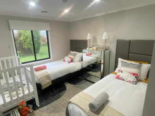 Katil atau katil-katil dalam bilik di The Jean House