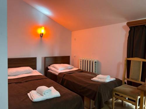 Postel nebo postele na pokoji v ubytování Nectar hotel