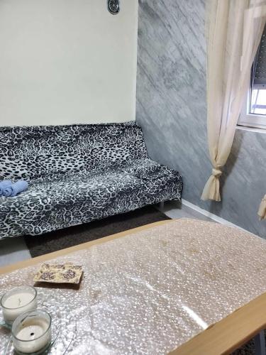 a living room with a couch and a table at Apartmani Sabotic in Sutomore