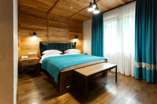 Ένα ή περισσότερα κρεβάτια σε δωμάτιο στο Ganz & SPA