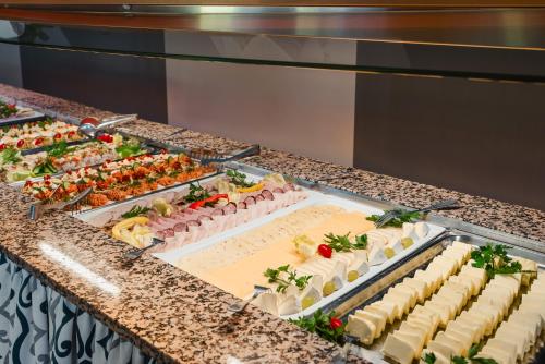 a buffet line with many different types of food at Rewita Waplewo in Maróz