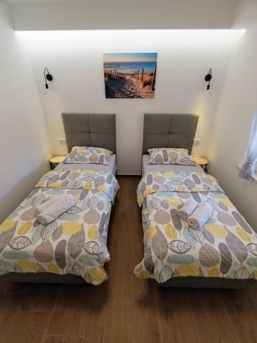 Katil atau katil-katil dalam bilik di Lennida Apartman with free parking