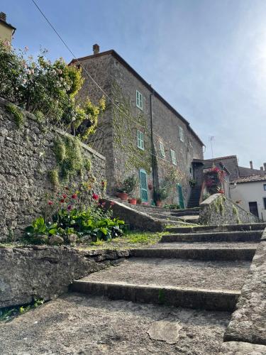 a group of stairs leading to a stone building at Michelangelo Dolce Vita in Prata