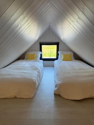 Ένα ή περισσότερα κρεβάτια σε δωμάτιο στο Olisi Tiny House