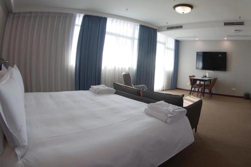 Ein Bett oder Betten in einem Zimmer der Unterkunft Shushe Hotel Shanghai