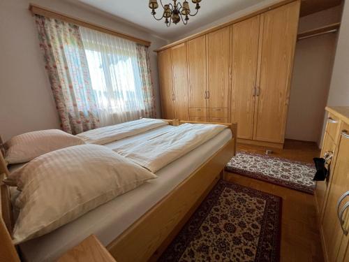 a bedroom with a large bed and a window at Ferienhaus Herta in Fresing
