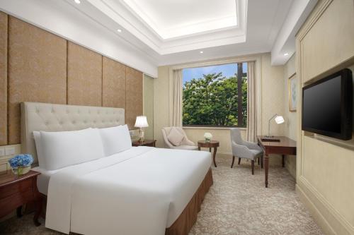 Carp Islet Resort Fuzhouにあるテレビまたはエンターテインメントセンター