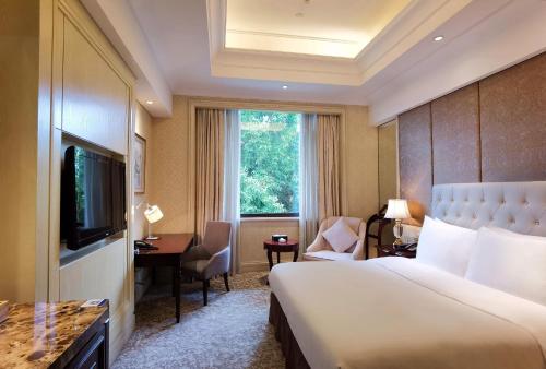 Carp Islet Resort Fuzhouにあるテレビまたはエンターテインメントセンター