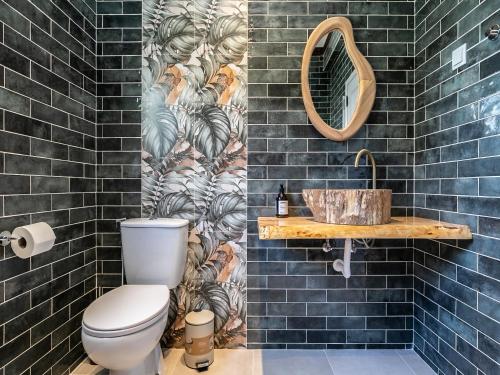 a bathroom with a toilet and a sink at Walk in Hostel Faro Airport in Faro