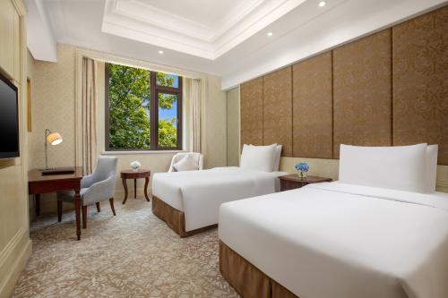 Carp Islet Resort Fuzhouにあるベッド