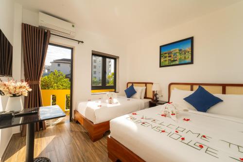 Voodi või voodid majutusasutuse Quyen's House Homestay Hoi An toas