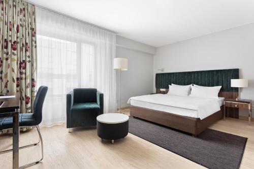 Posteľ alebo postele v izbe v ubytovaní Hotel Moderno Poznań