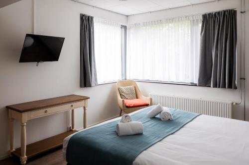 Ένα ή περισσότερα κρεβάτια σε δωμάτιο στο Rooms25