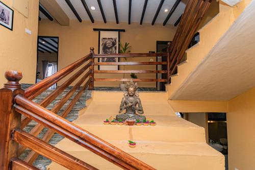 a stairway with a statue of a teddy bear at Pokhara Boutique Hotel in Pokhara