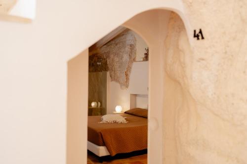 a bedroom with a bed in a room at Il Belvedere in Matera