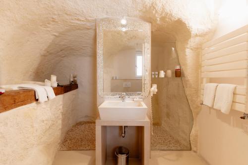 a bathroom with a sink and a mirror at Il Belvedere in Matera