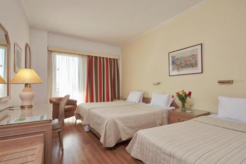 Candia Hotelにあるベッド