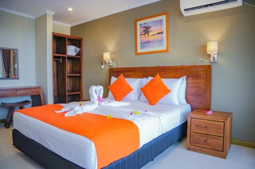 a bedroom with a bed with a stuffed animal on it at The Ridge Residence in Victoria