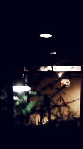 a blurry picture of lights in a building at night at Maison de Hill Home in Dồng Văn