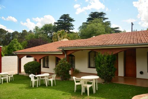Κήπος έξω από το Apart Cabañas La Estancia