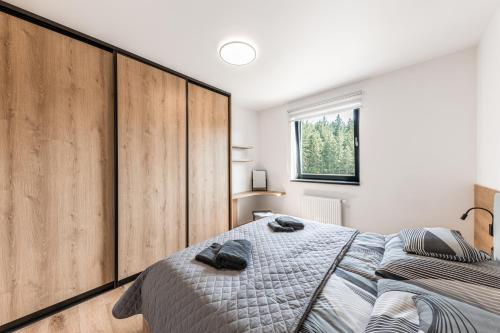 Postel nebo postele na pokoji v ubytování Apartmán Charlie