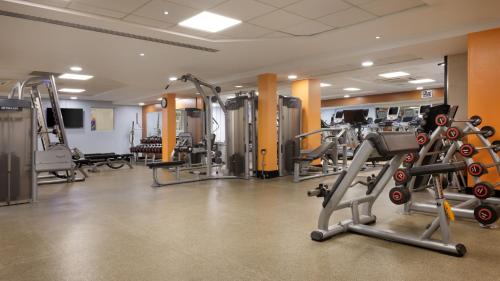 a gym with several treadmills and cardio machines at Hilton Leicester Hotel in Leicester