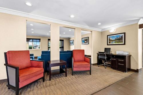 an office with two chairs and a desk with a computer at Comfort Inn Modesto in Modesto