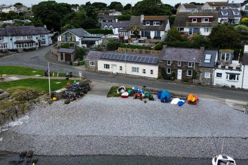 an aerial view of a street with a group of people at Glan Y Don Moelfre in Moelfre