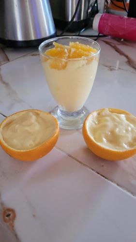 two halves of an orange and a glass of orange juice at Tigmi Bulbul in Id AÃ¯ssa