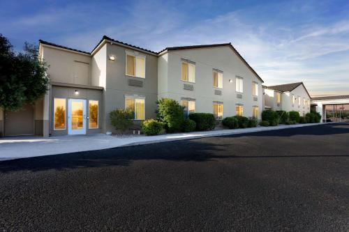 a large apartment building with a street in front at Comfort Inn & Suites I-25 near Spaceport America in Truth or Consequences