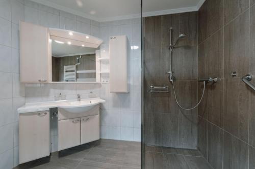 a bathroom with a shower and a sink at Haus Schennach in Längenfeld