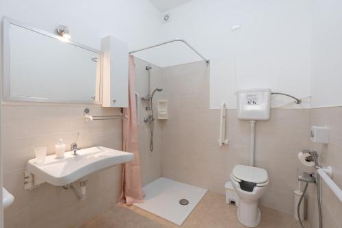 a bathroom with a sink and a shower and a toilet at Cuore di Conchiglia 3 in Custonaci