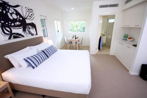Ένα ή περισσότερα κρεβάτια σε δωμάτιο στο Domain Serviced Apartments