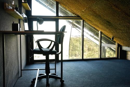 a desk in a room with a chair in front of a window at Villa Hillcrest in Weligama