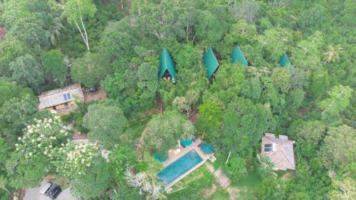 an aerial view of a house in the forest at Villa Hillcrest in Weligama