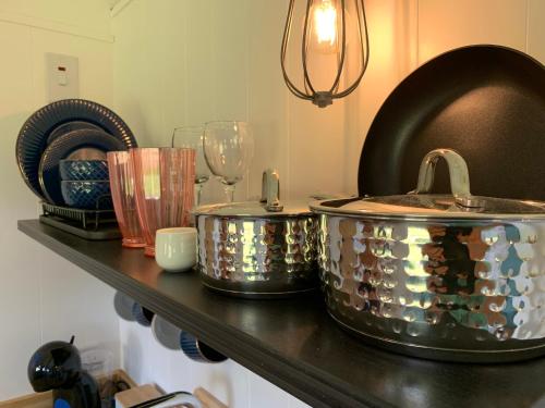 a counter with two pots on top of a table at St. Kew Shepherd Huts in Wadebridge